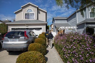 FBI agents canvass the neighborhood of the suspected White House Correspondents' Dinner shooter on 26 April 2026 in Torrance, California